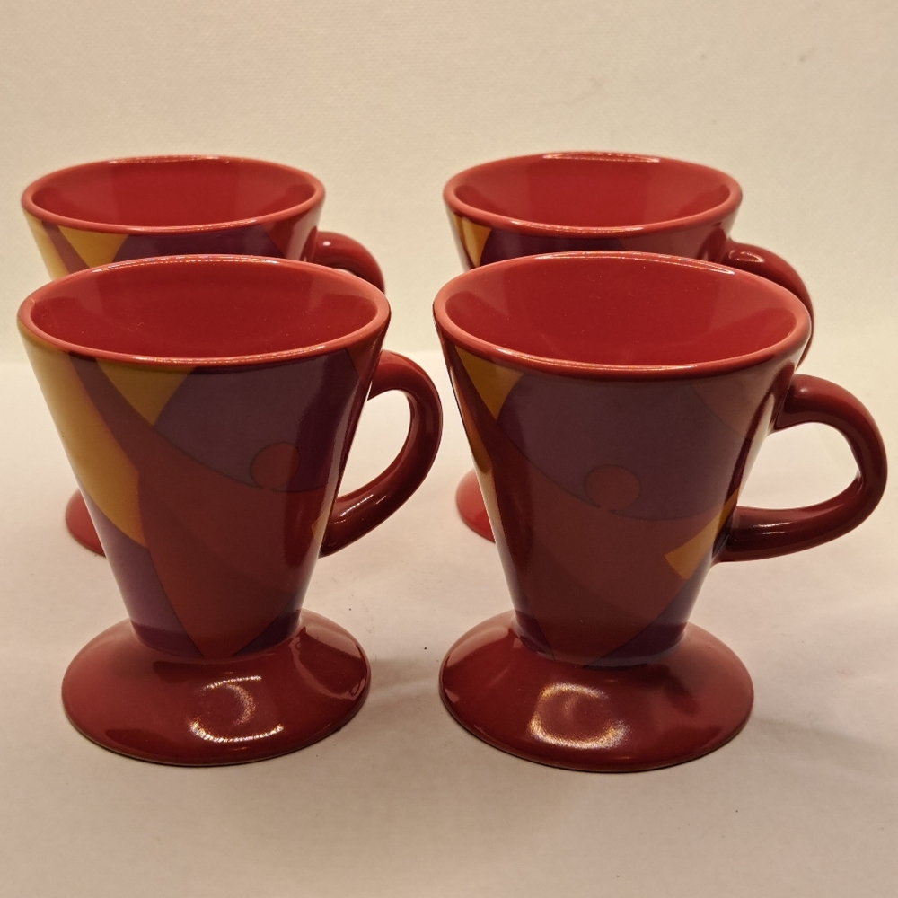 Four demitasse or expresso cone shaped cups.